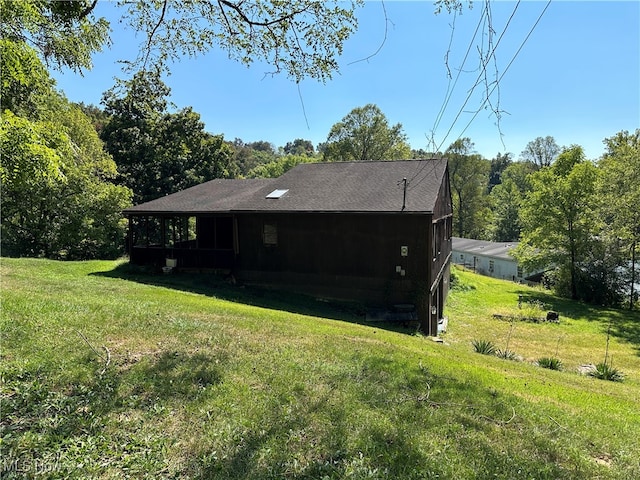 view of home's exterior with a lawn