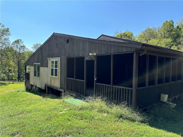 view of side of property with a yard