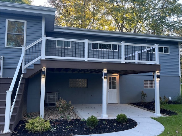 exterior space featuring cooling unit and a patio area