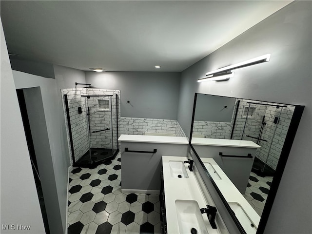 bathroom featuring vanity and an enclosed shower