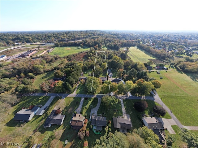 birds eye view of property with a rural view