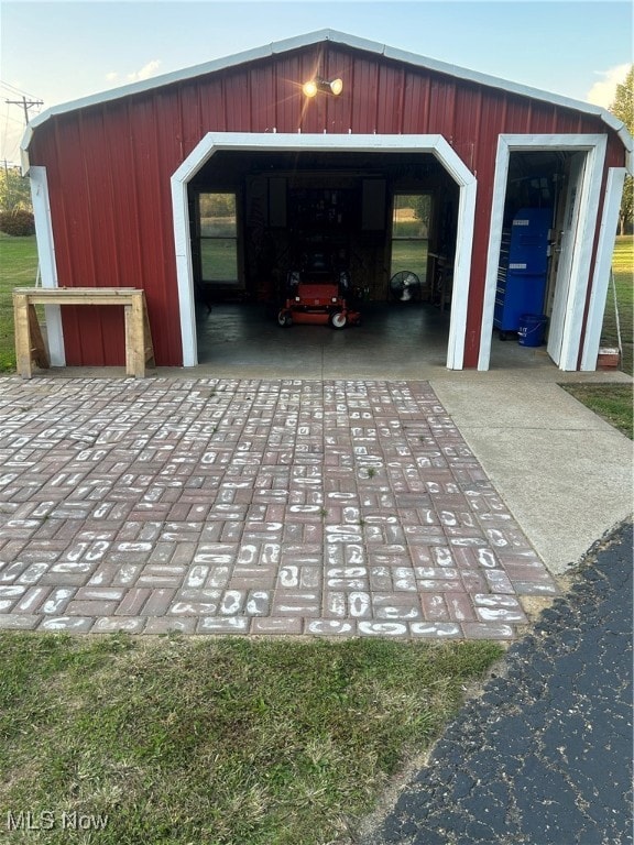 garage featuring wood walls