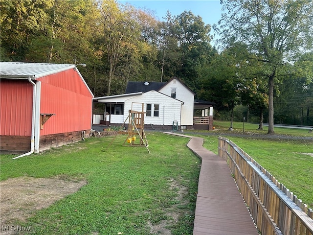 rear view of property featuring a yard