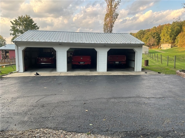 garage featuring a lawn