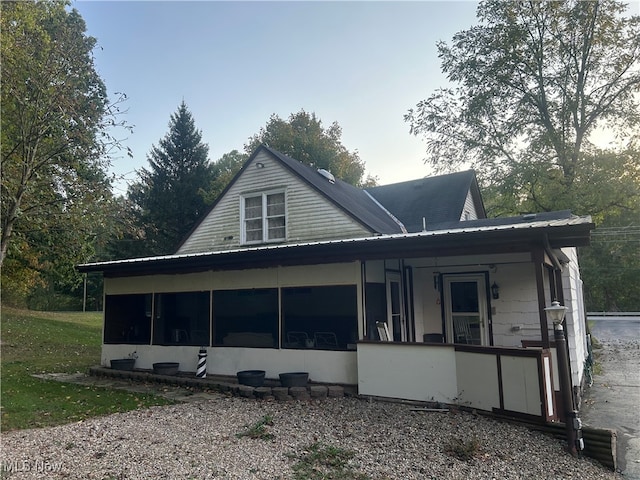 view of front of house with a sunroom