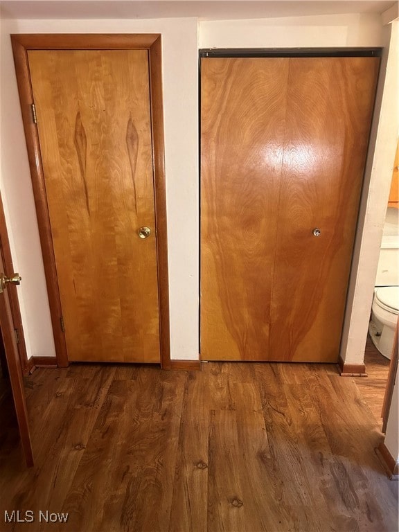 hallway featuring dark hardwood / wood-style floors