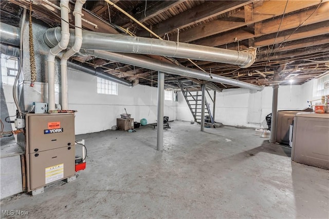 basement featuring washing machine and clothes dryer