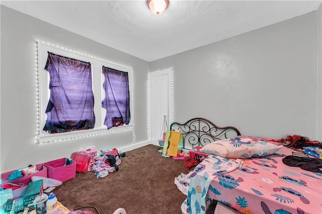 carpeted bedroom with a textured ceiling