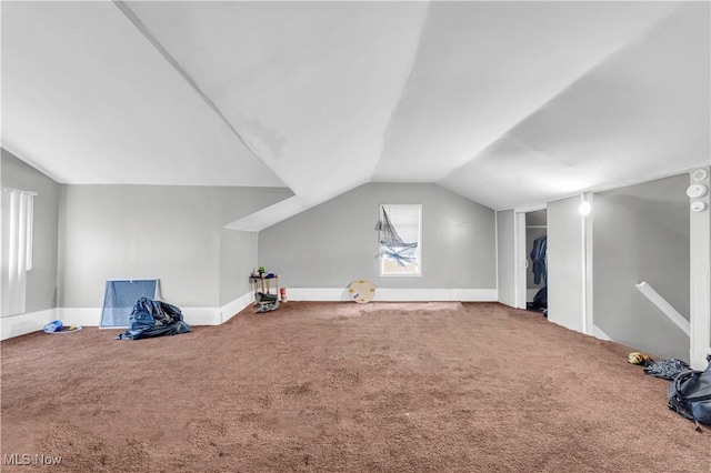 bonus room featuring carpet flooring, baseboards, and lofted ceiling