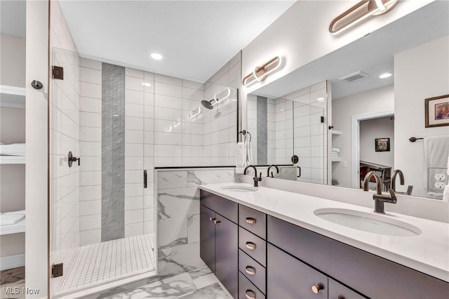 bathroom with walk in shower and vanity