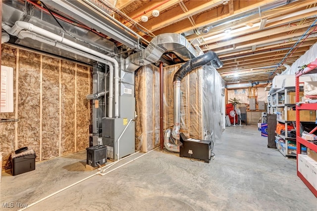 basement with heating unit and electric panel