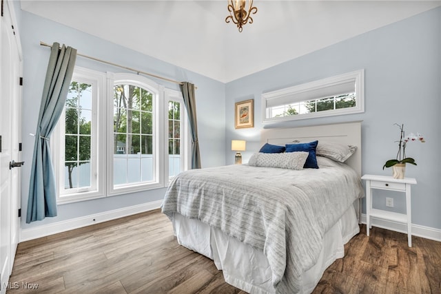 bedroom featuring hardwood / wood-style flooring and multiple windows