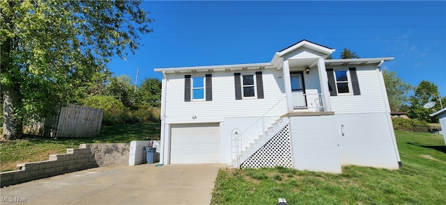 view of front of property featuring a garage and a front yard