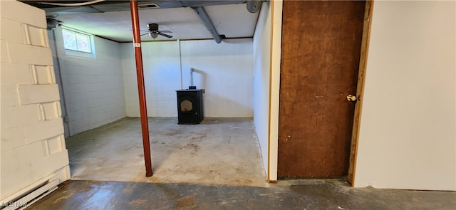 basement with ceiling fan and a baseboard radiator