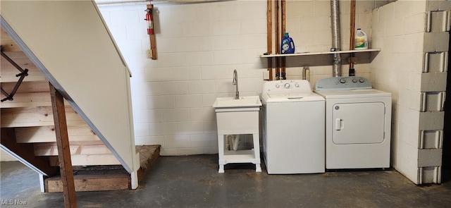 clothes washing area featuring separate washer and dryer