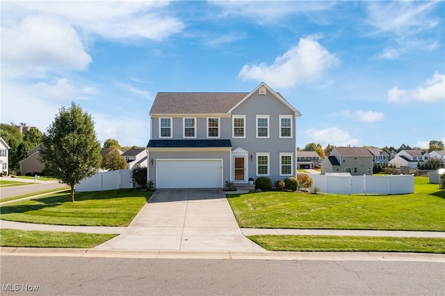 view of front of home featuring a garage and a front lawn