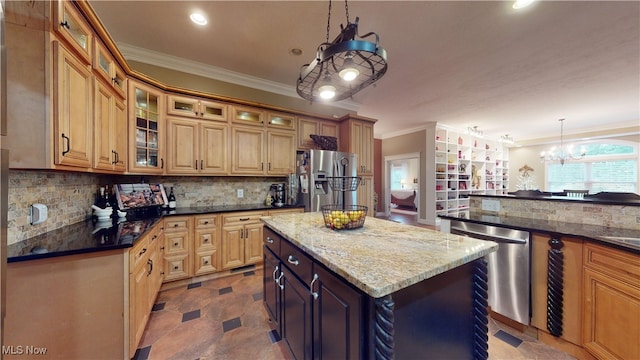 kitchen featuring pendant lighting, a kitchen island, backsplash, stainless steel appliances, and dark stone counters