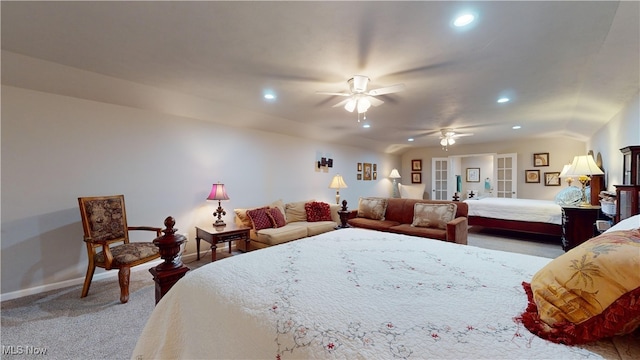 carpeted bedroom with vaulted ceiling, ceiling fan, and french doors