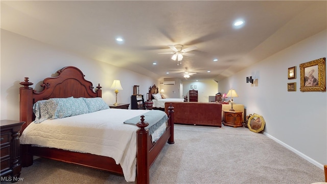 carpeted bedroom with a wall mounted AC and ceiling fan