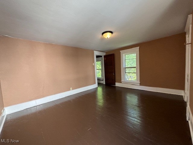 empty room featuring dark hardwood / wood-style floors