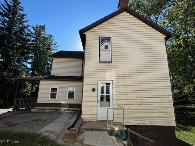 805 Quarry St, Marietta, OH 45750 - rear view of property with a chimney