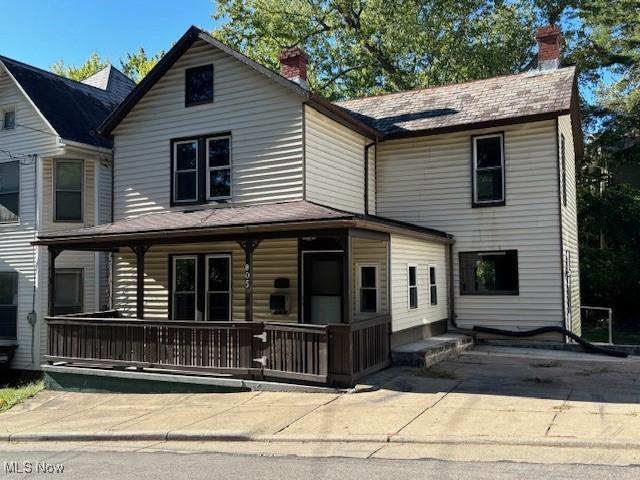 805 Quarry St, Marietta, OH 45750 - traditional-style house with a chimney and a porch