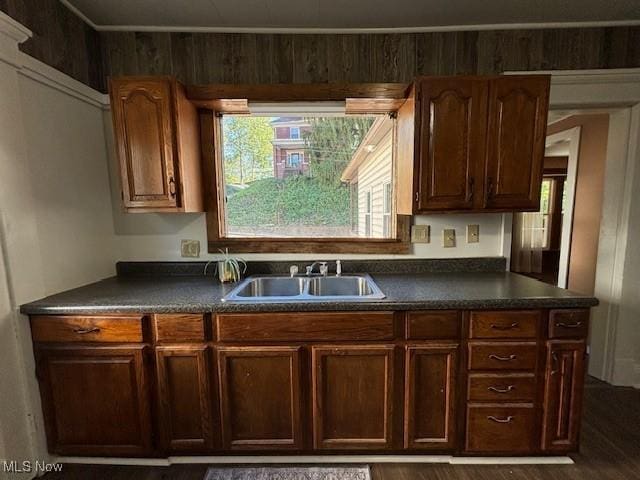 805 Quarry St, Marietta, OH 45750 - kitchen with dark countertops, a sink, and dark wood-type flooring