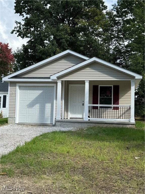 view of front of house with covered porch and a garage