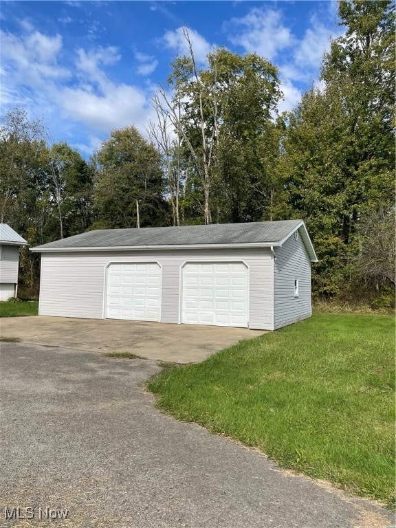 garage with a lawn