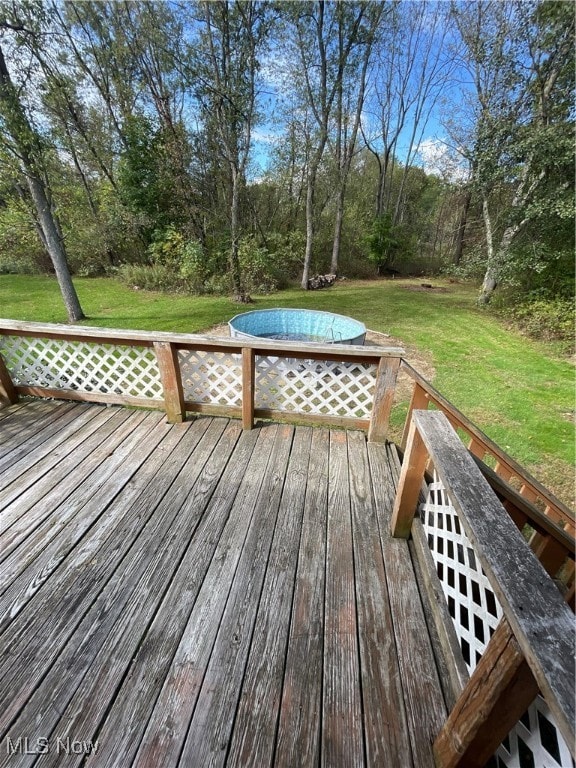 wooden deck with a yard