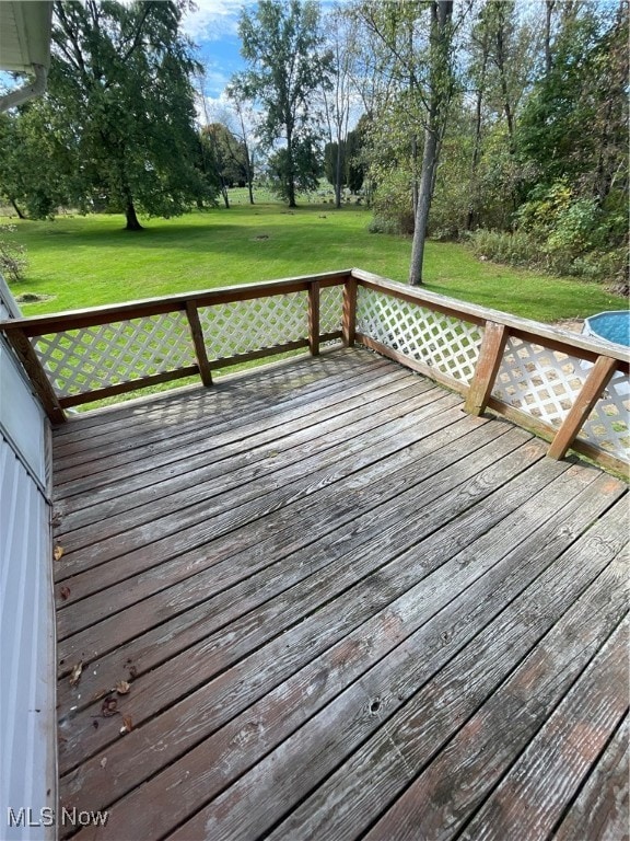 deck featuring a lawn