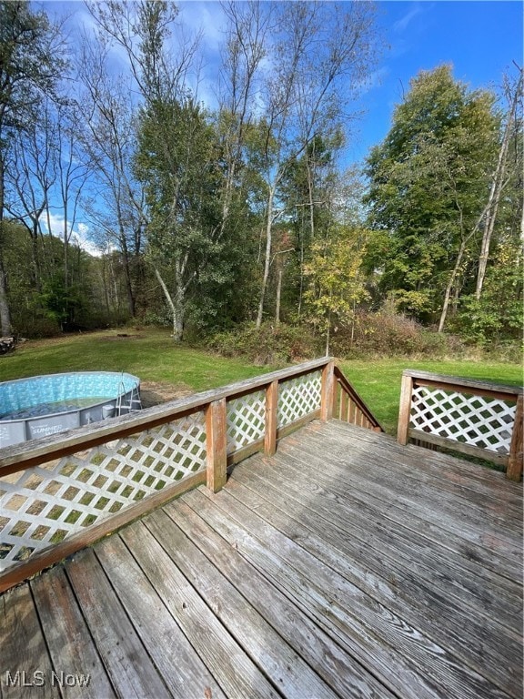 wooden deck with a yard