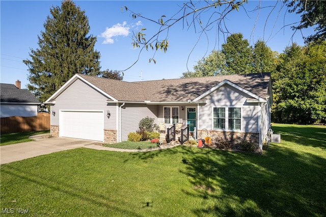 ranch-style home with a garage and a front yard