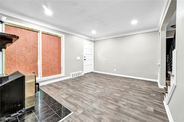 foyer entrance featuring dark hardwood / wood-style floors