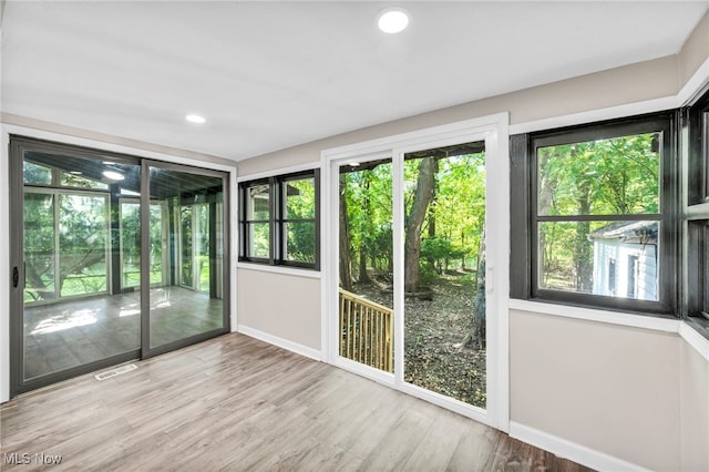 doorway to outside featuring light wood-type flooring