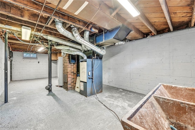 basement with heating unit and water heater