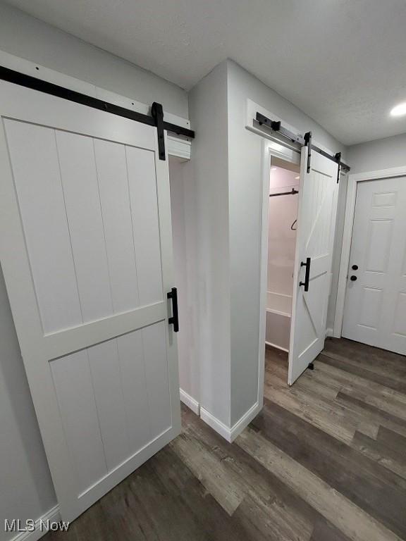 139 Patterson Rd, Weirton, WV 26062 - interior space featuring wood finished floors, a barn door, and baseboards