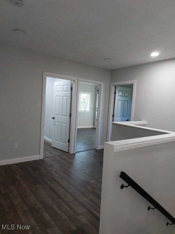 139 Patterson Rd, Weirton, WV 26062 - hall featuring an upstairs landing, recessed lighting, dark wood finished floors, and baseboards