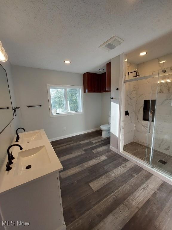 139 Patterson Rd, Weirton, WV 26062 - full bathroom with a sink, a textured ceiling, visible vents, and toilet