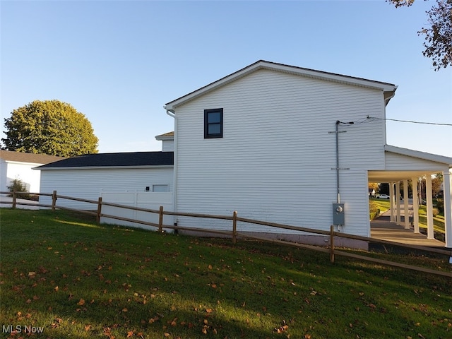 view of side of property with a yard