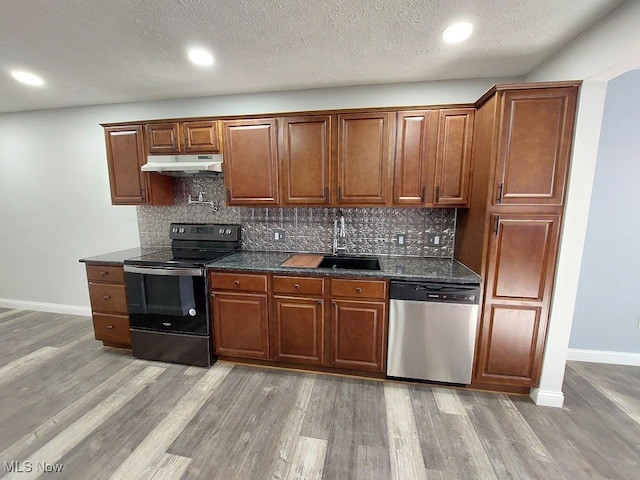 kitchen featuring stainless steel dishwasher, tasteful backsplash, sink, light hardwood / wood-style floors, and black range with electric cooktop