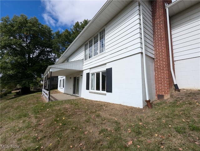 view of home's exterior featuring a lawn