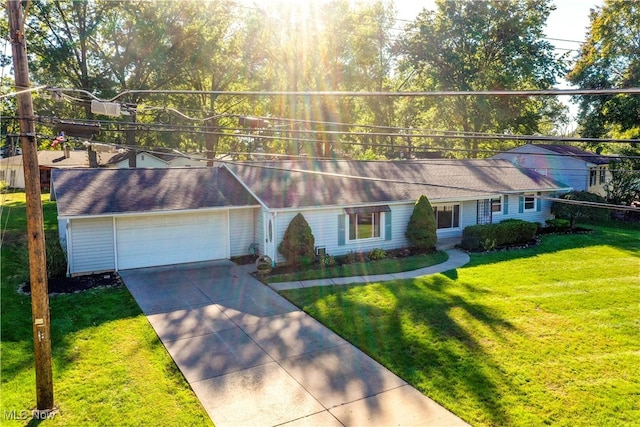 ranch-style home with a front yard and a garage