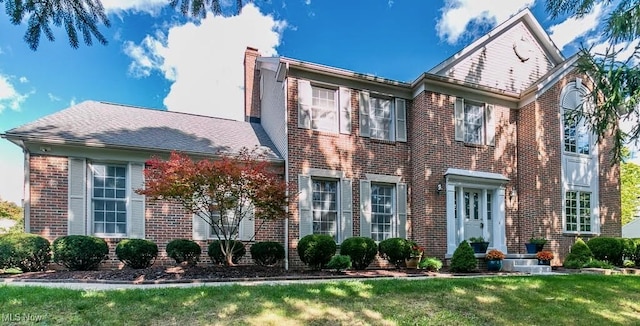 view of front of home with a front yard