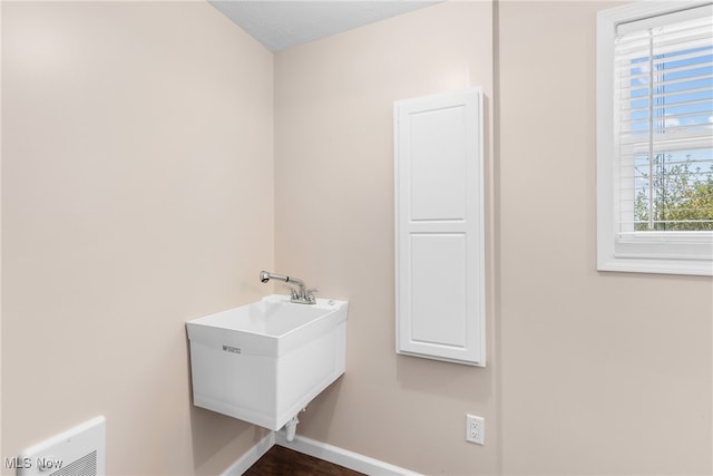 bathroom with sink and a textured ceiling