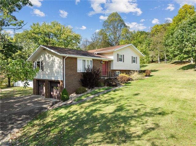 view of front of home featuring a garage and a front yard