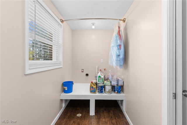 bathroom featuring hardwood / wood-style flooring and walk in shower