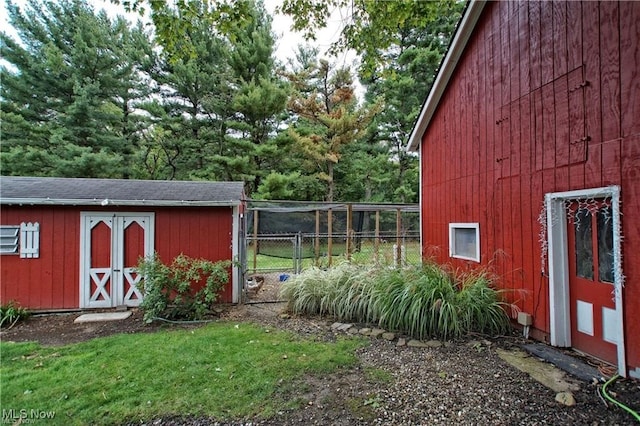 view of outbuilding featuring a yard