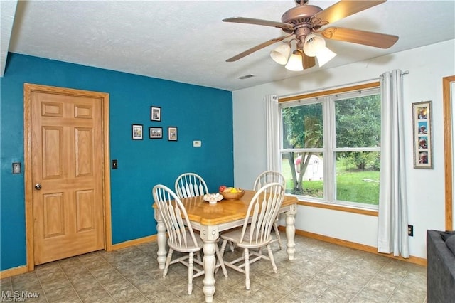 dining space featuring ceiling fan