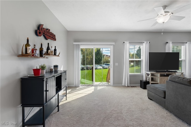 carpeted living room featuring ceiling fan